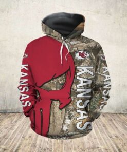 Official N.F.L.Kansas City Chiefs Pullover Hoodies/Detailed 3D Custom Graphic Printed Real Tree Camo. Punisher Skull Design/Official Custom Chiefs Logos & Official Classic Chiefs Colors/Warm Premium Chiefs Game Day Team Pullover Hoodies